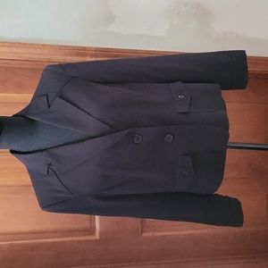 Black blazer with two buttons down front and two pockets with buttons